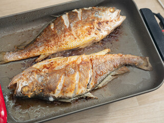 Grilled fish in a pan