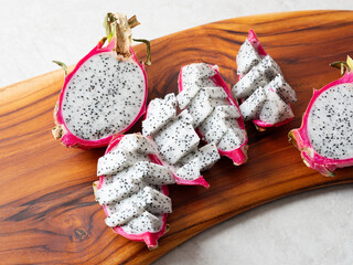 dragon fruit on wooden plate	