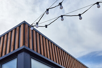 garland of LED light bulbs connected to the street booth