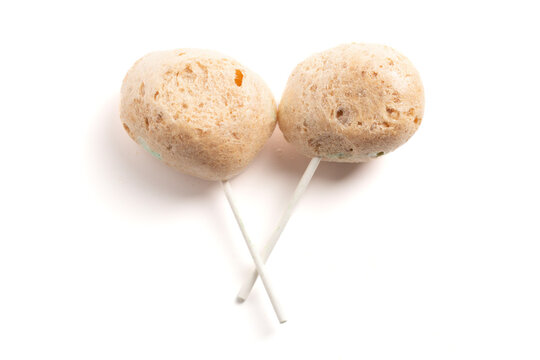 Freeze Dried Sour Caramel Apple Lollipops on a White Background