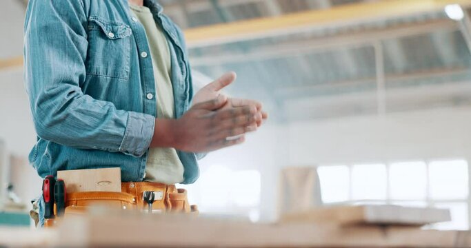 Hands, clap and wood at workshop or sawdust as carpenter for small business renovation, remodeling or furniture. Person, contractor and manufacturing or lumber industry for handmade, diy or equipment