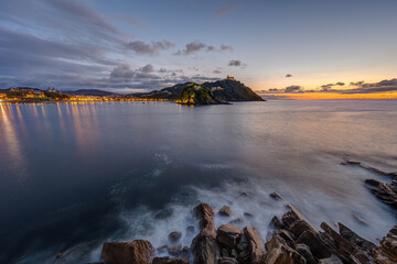 The bay of San Sebastian in Spain with the Monte Igueldo at sunset