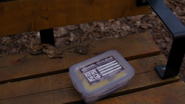 Ottawa Ontario Canada -Dec 31st  2023 - Geocaching travel game box on bench