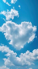 Naklejka na ściany i meble Puffy clouds form a heart shape on the blue sky, summer day, beautiful landscape