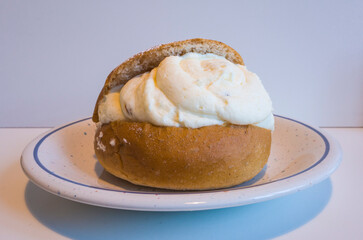 Swedish semla, shrove bun, whipped cream filled cardamom bun with almond paste, Close up of sweet...