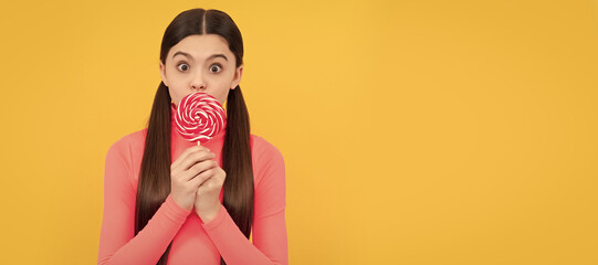 oh my god. teen dental care. sweet tooth. yummy. surprised girl hold lollipop. Teenager child with sweets, poster banner header, copy space. - obrazy, fototapety, plakaty