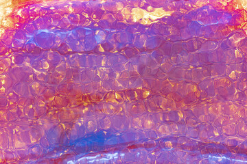 Colorful Abstract Iridescent Glass Texture Captured in Close-Up