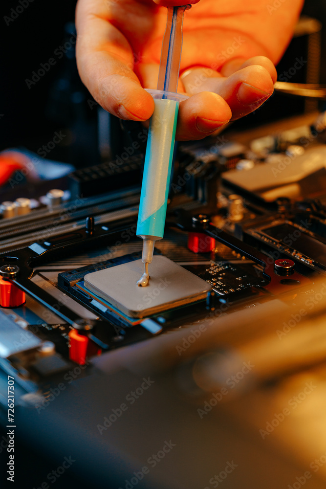 Poster applying thermal paste to a computer processor