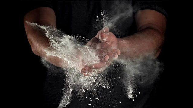 Chef claps his hands with flour. Filmed on a high-speed camera at 1000 fps. High quality FullHD footage