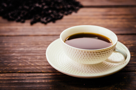 Black coffee cup on wooden background - Vintage effect style pictures