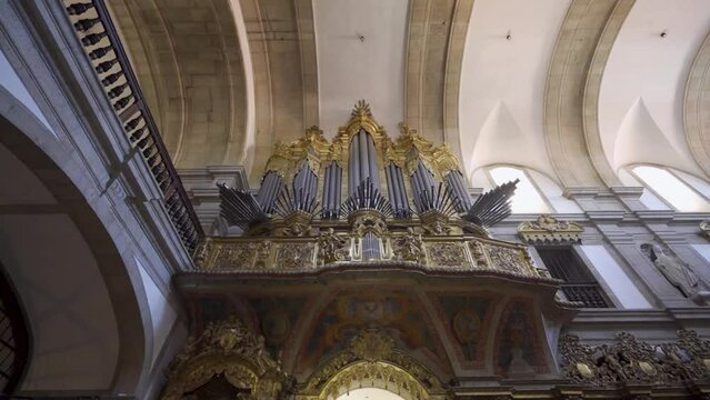 An inside view of a Portuguese monastery, called 'Santa Mafalda de Arouca Monastery' containing a museum of sacred art within, located in Arouca. Shot of a pipe organ.