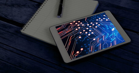 Image of tablet with data processing in office