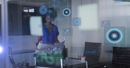 Image of data processing and scopes over african american businesswoman in office