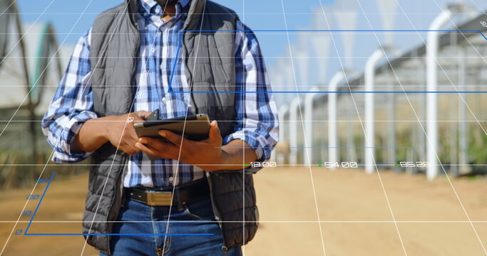 Image of data processing and statistics over biracial engineer using tablet - Powered by Adobe