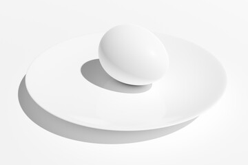 Chicken eggs lie in a ceramic plate on a white background.