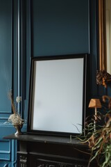 empty black picture frame standing on a shelf in a vintage appartement