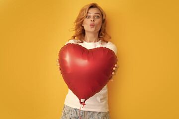 funny redhead woman with red heart balloon. charity and donation
