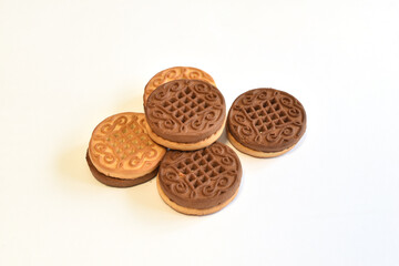Round cookies with filling on white.