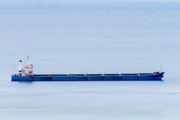 Commercial cargo ship on a roadstead at sea