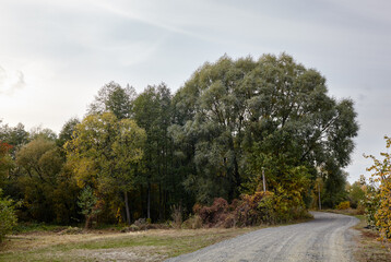 A gravel road at rural Europe. Suburban road path