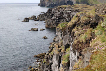 Steep cliff on the coast of Heimaey island- Vestmannaeyjar- Westman Islands-Iceland   