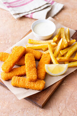 Fish fingers with french fries and white sauce. Sea food. Fish and chips.