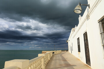 Houses in the promenade of Chipiona Beach on a stormy day © SoniaBonet