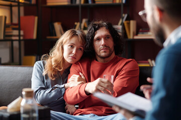 Caucasian man and woman in love working through relationship problems with help of professional family psychologist