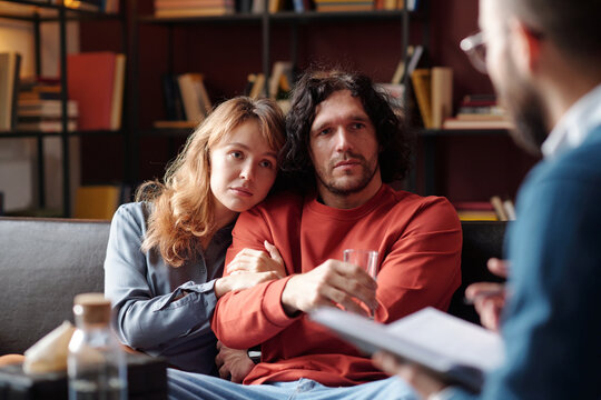 Caucasian man and woman in love working through relationship problems with help of professional family psychologist