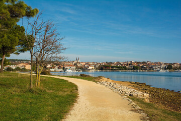 A coastal footpath on Vizula Peninsula in Medulin, Istria, Croatia. Medulin town is in the...