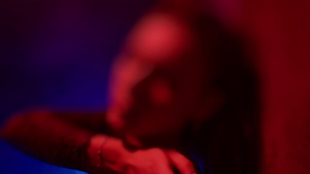 Sexual abstinence excitement arousal concept. Passion temptation desire. Intimate. Lady of the night in erotically lingerie standing against wall. Hot mistress. One-night stand woman. Tilt-shift blur