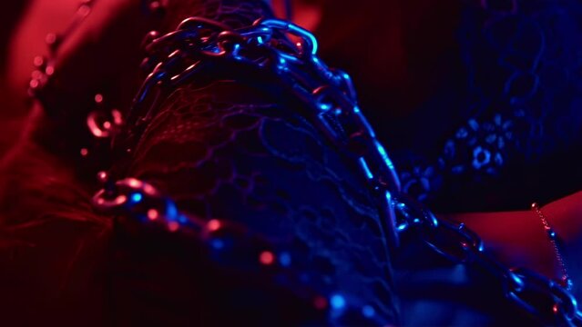 Sexual abstinence arousal excitement concept. BDSM fetish. Lust. Desire passion temptation. Girl bound in metal chains. Intimate adult games with punishment. Hot mistress. Female pervert slave