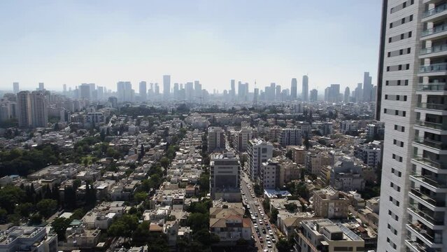 Aerial footage of Ramat Gan city, in the background the skyline of the city and the towers of Tel Aviv city.