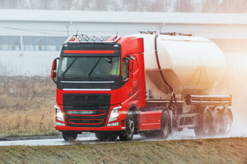 A White Tank Truck on the road Delivering Goods Safely including liquid petroleum gas LPG or propane.