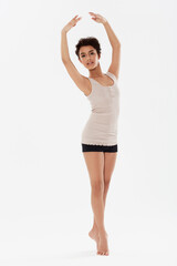 Dance, ballet and portrait of ballerina on a white background for performance, fitness and training. Ballerina, dancer and isolated woman pose for balance, creative routine and practice in studio