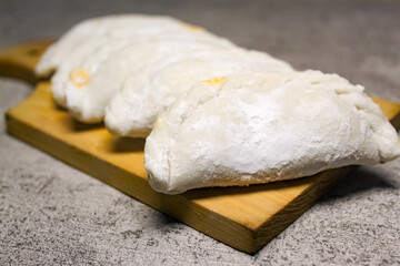 raw dough on a cutting board