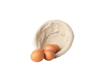 PNG, eggs in a round basket, isolated on white background.