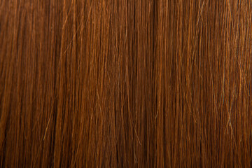 Close up of brown hair as background. Texture of natural hair..