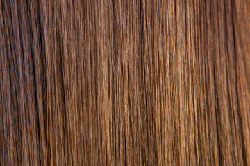Close up of brown hair as background. Texture of natural hair..