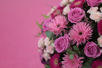 Bunch of flowers. Beautiful bouquet of fresh pink roses in full bloom on pink background, close up. Top view.  Valentine day or Mother day, love concept. Stock photo