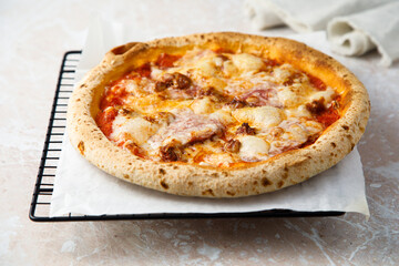 Traditional homemade pizza with ham and cheese