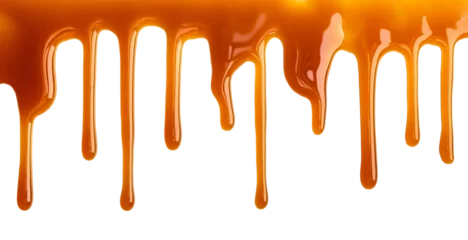 Deurstickers Dripping Melted caramel sauce drops isolated on transparent background © colnihko