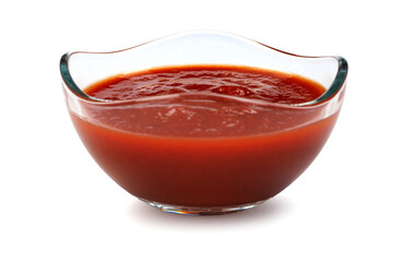 Ketchup in a glass cup isolated on a white background. Tomato sauce .