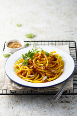Pasta with red pesto and almond