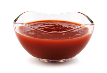 Ketchup in a glass cup isolated on a white background. Tomato sauce .
