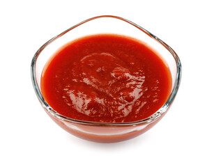 Ketchup in a glass cup isolated on a white background. Tomato sauce .