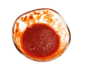 Ketchup in a glass cup isolated on a white background. Tomato sauce .