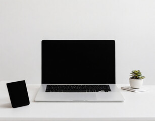 Fototapeta premium Laptop on white table to white wall