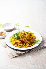 Pasta with red pesto and almond