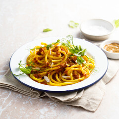 Pasta with red pesto and almond
